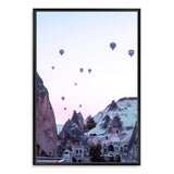 Balloons Over Cappadocia-The Paper Tree-architecture,balloons,cappodocia,city,destination,horizon,hot air balloons,mountains,pink,portrait,premium art print,purple,sunset,town,travel,turkey,villa,wall art,Wall_Art,Wall_Art_Prints