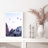 Balloons Over Cappadocia-The Paper Tree-architecture,balloons,cappodocia,city,destination,horizon,hot air balloons,mountains,pink,portrait,premium art print,purple,sunset,town,travel,turkey,villa,wall art,Wall_Art,Wall_Art_Prints