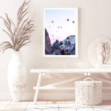 Balloons Over Cappadocia-The Paper Tree-architecture,balloons,cappodocia,city,destination,horizon,hot air balloons,mountains,pink,portrait,premium art print,purple,sunset,town,travel,turkey,villa,wall art,Wall_Art,Wall_Art_Prints