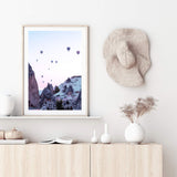 Balloons Over Cappadocia-The Paper Tree-architecture,balloons,cappodocia,city,destination,horizon,hot air balloons,mountains,pink,portrait,premium art print,purple,sunset,town,travel,turkey,villa,wall art,Wall_Art,Wall_Art_Prints